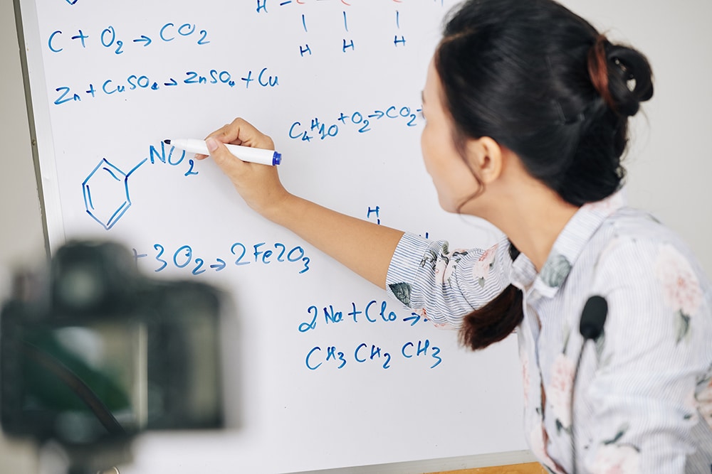 Teacher drawing chemical structure